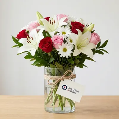 Roses and Seasonal Flowers in a Glass Vase