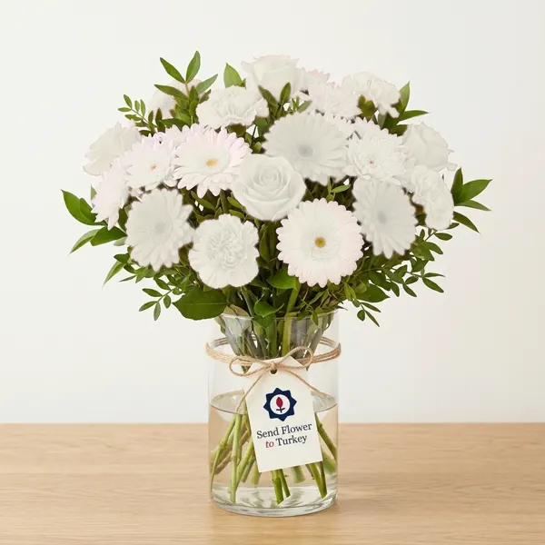 White Seasonal Flowers in a Glass Vase