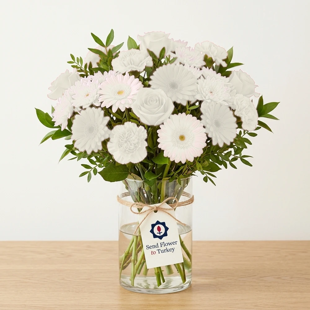 White Seasonal Flowers in a Glass Vase