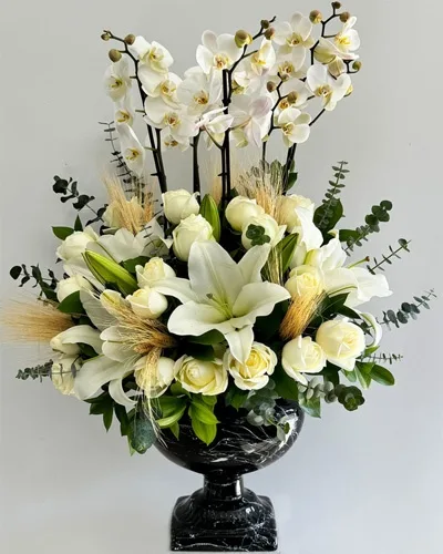 White Orchids, Lilies and Roses in a Marble-Look Urn